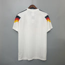 camisa-camiseta-alemanha-selecao-selecao-alema-alema-adidas-versao-versao-torcedor-masculina-1990-home-casa-i-principal-1-branca-branco-amarela-amarelo-preta-preto-vermelha-vermelho-r_95470c6a-ec8c-4159-9c69-c8feb01062e6
